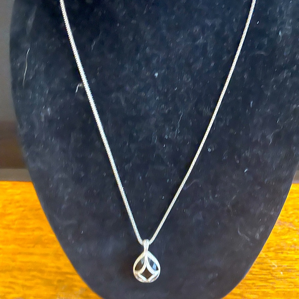 Silver with Planck pendulum GORGEOUS with a little black dress